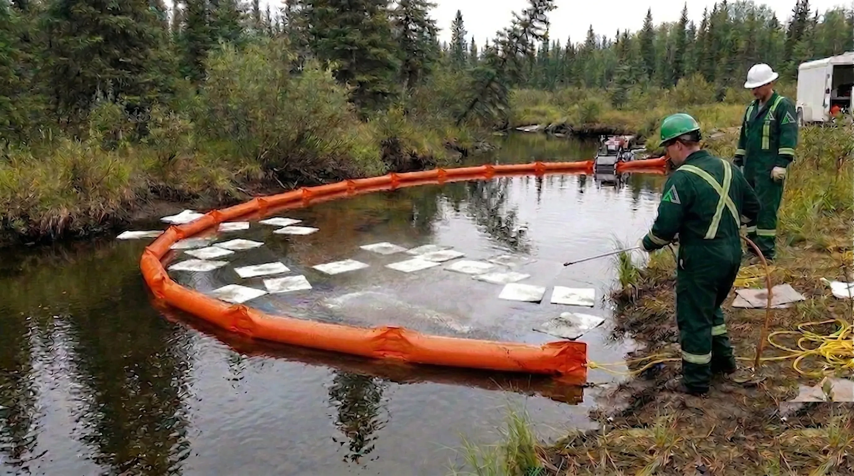 Creek spill remediation site showing containment and on-site treatment