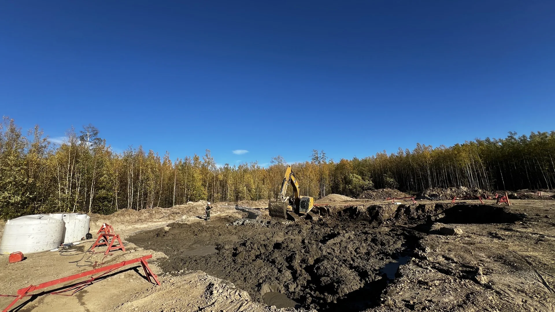 Excavation site with contaminated soil in boreal forest setting